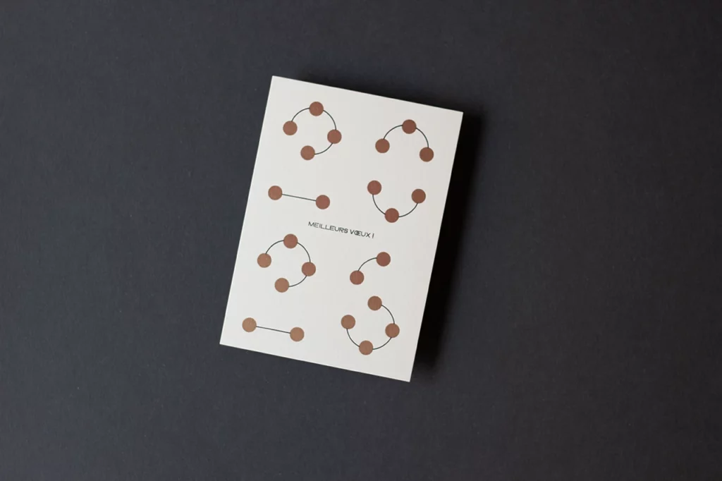 Carte de vœux simple « Planètes 2026 », imprimée en letterpress en version dorée sur les planètes, création graphique MMONOKL.